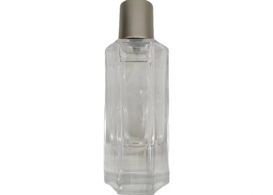 علبة عطر معدنية مستديرة مع زجاجة زجاجية عطر